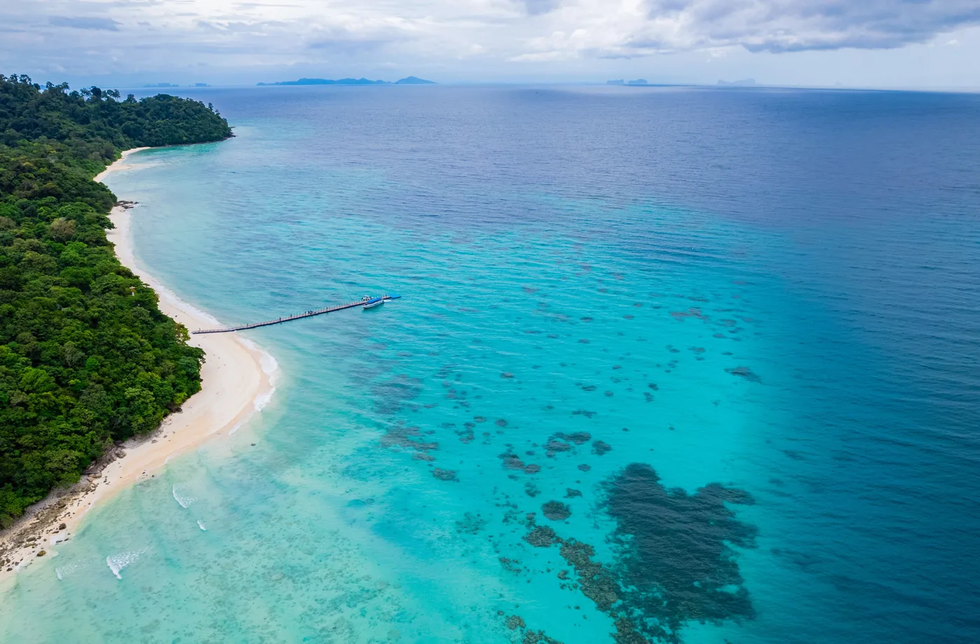 Long curve of beach and reef on Rok Island