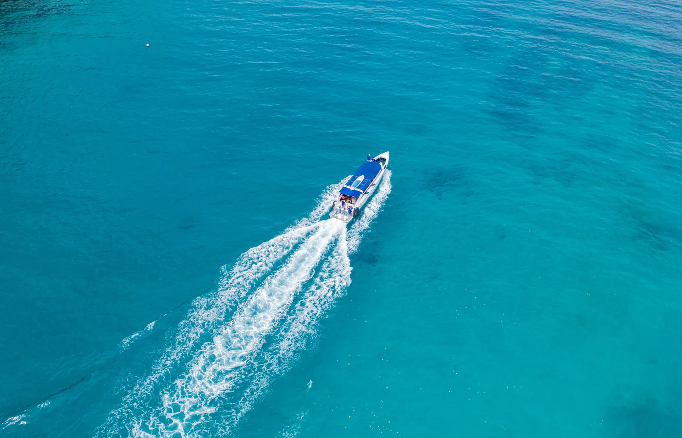 Speedboat travelling across clear blue water
