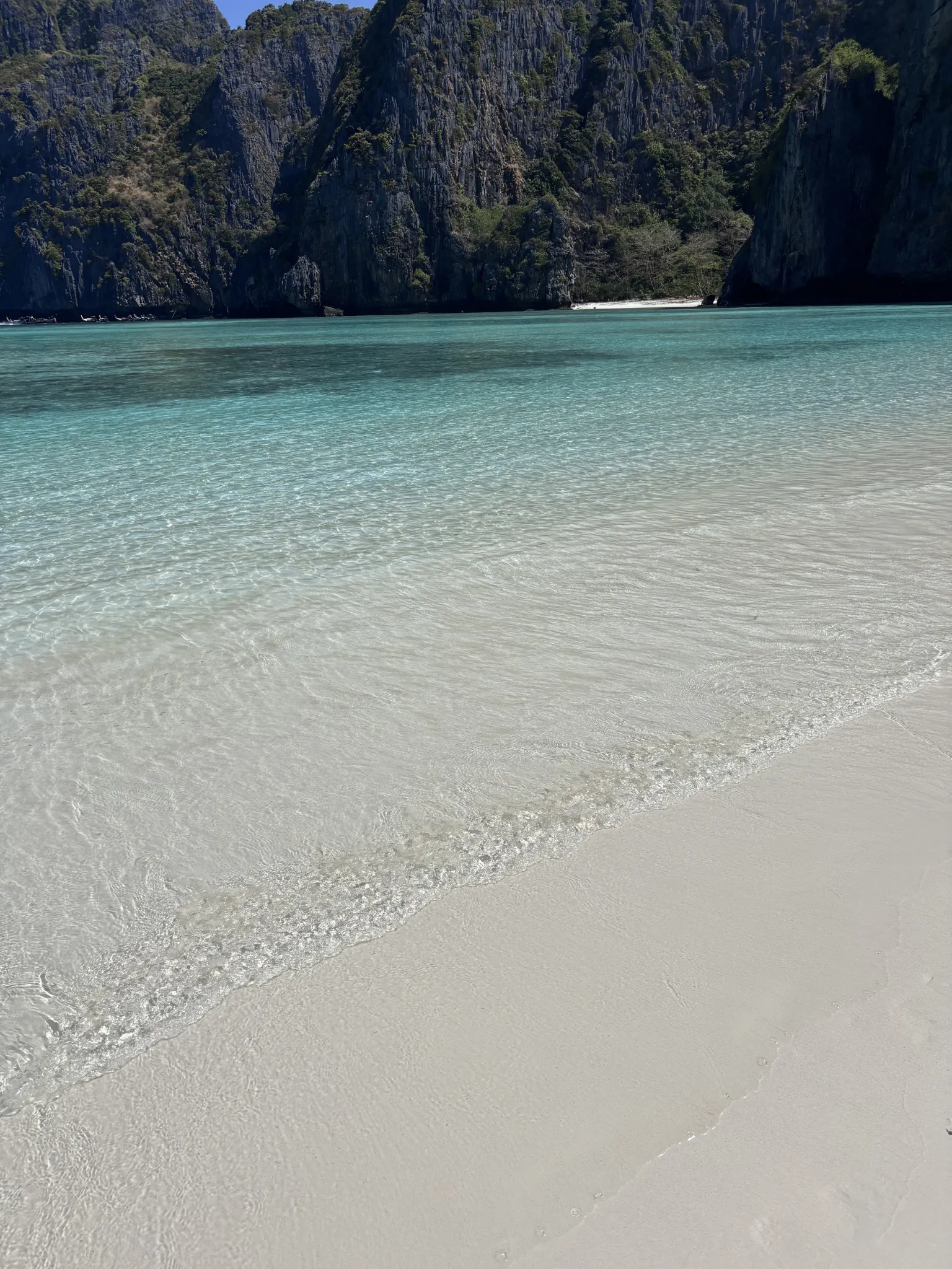 Turquoise water and limestone cliffs at Maya Bay