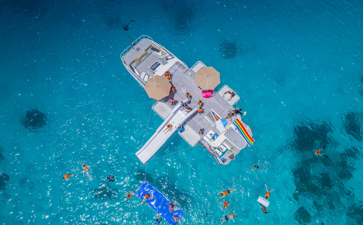 Speedboat and guests in turquoise water