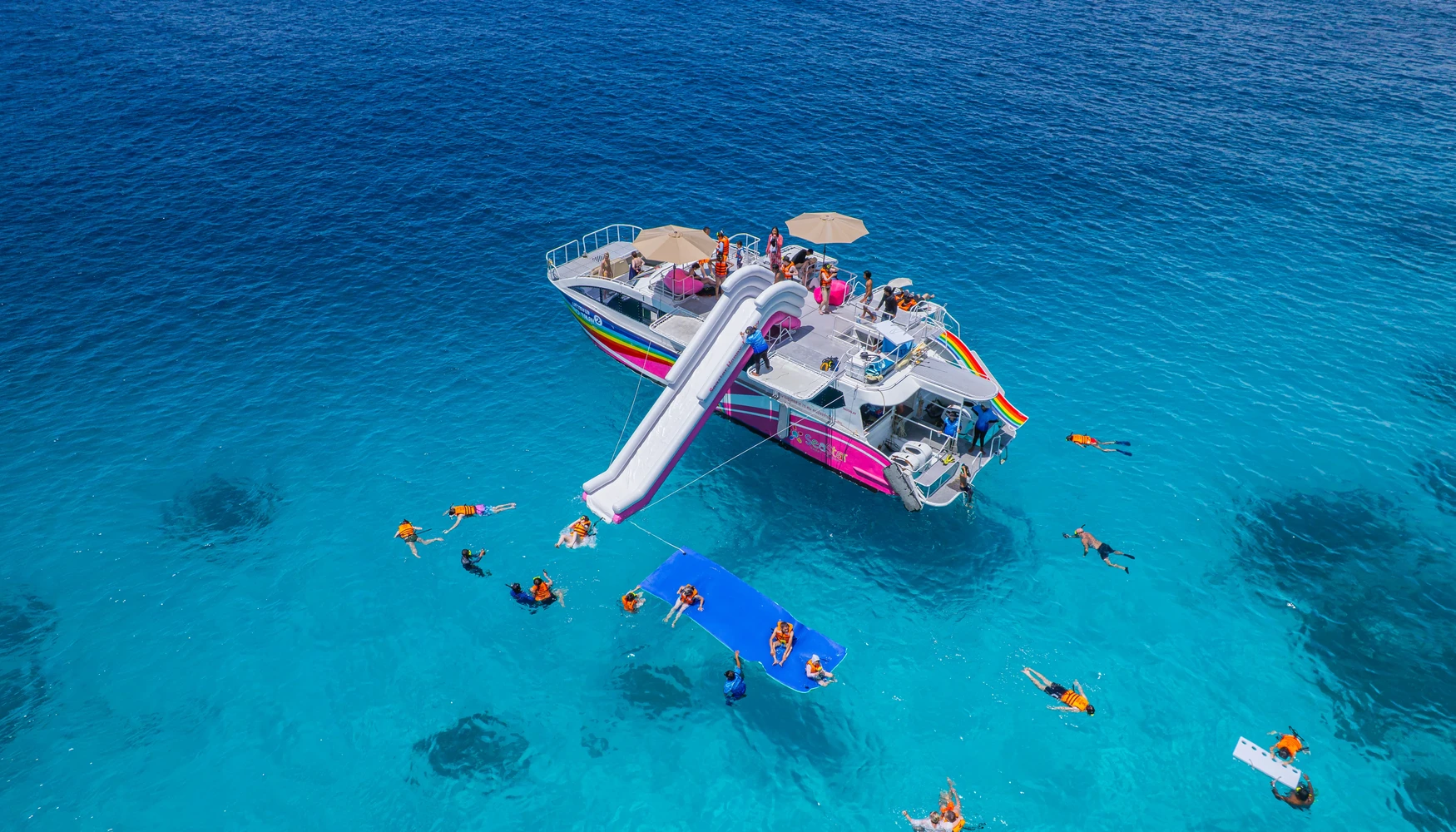 Speedboats waiting in deep blue tropical water