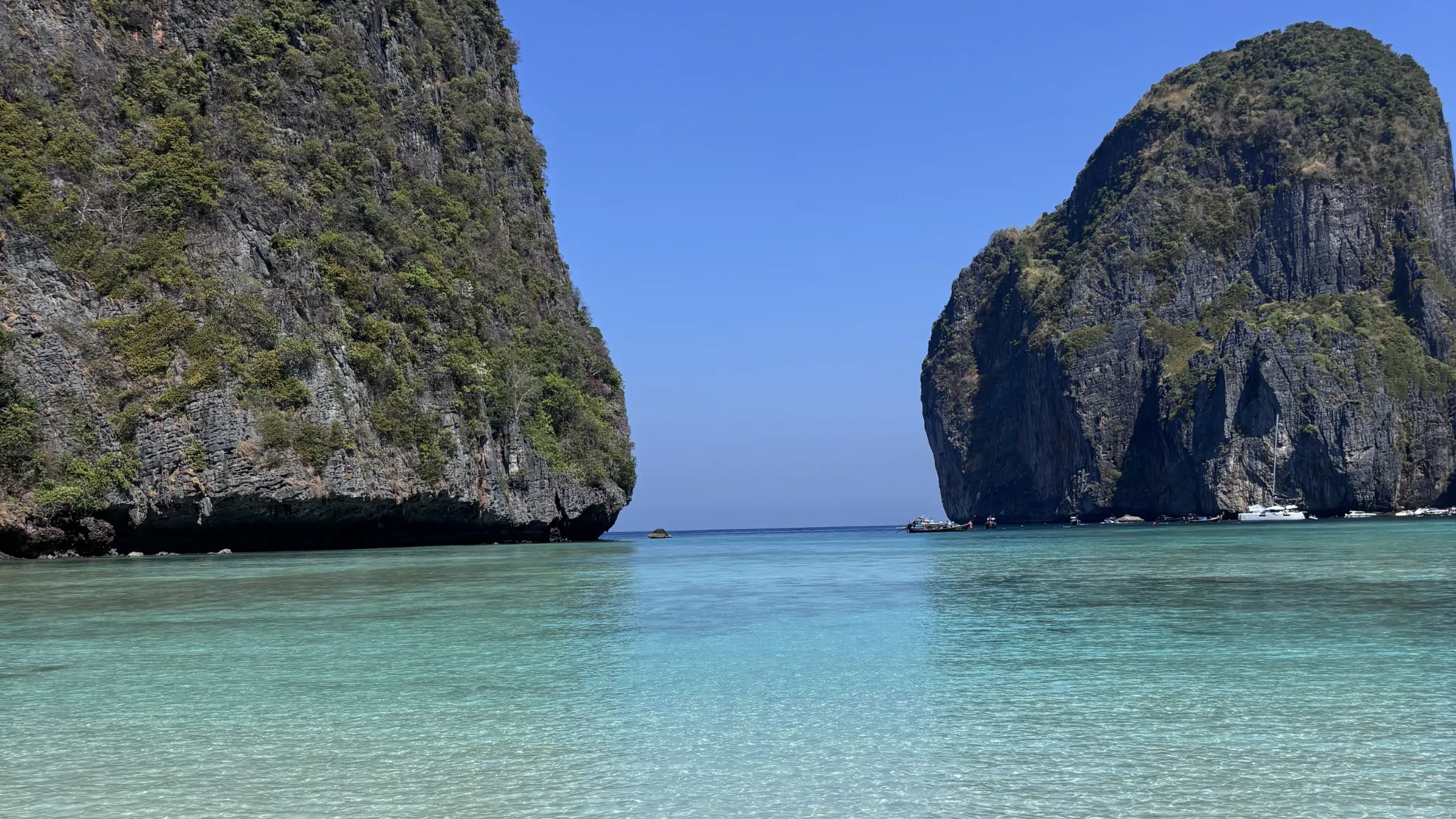 Turquoise lagoon framed by the limestone cliffs of Phi Phi