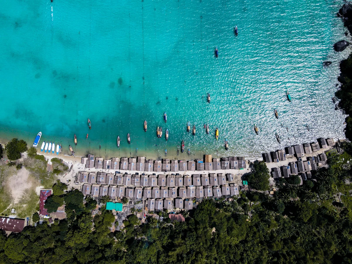 Traditional boats and the Moken village seen from above